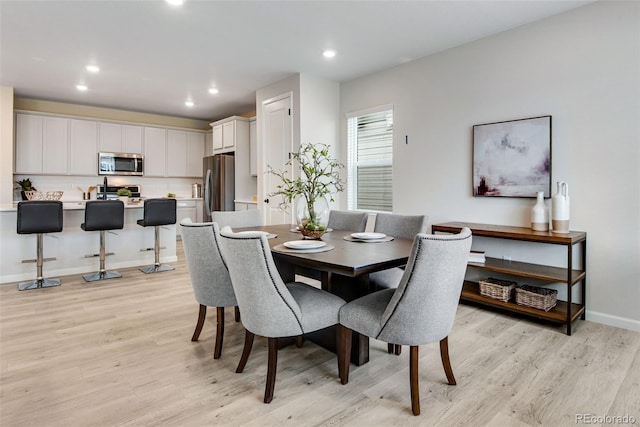 dining space featuring light hardwood / wood-style flooring