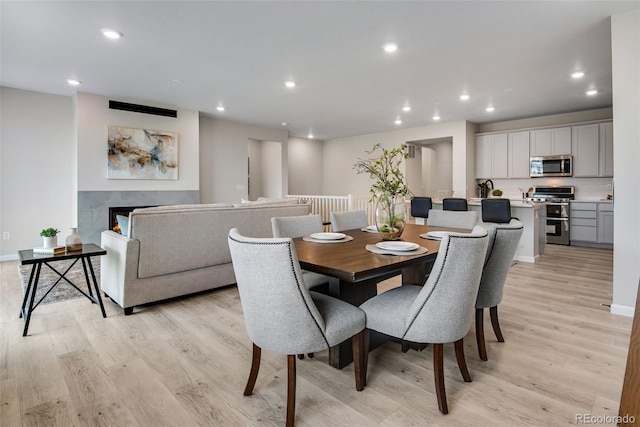 13351 E 100th Pl, Commerce City, CO 80022 - dining area featuring light wood-style floors, baseboards, and recessed lighting