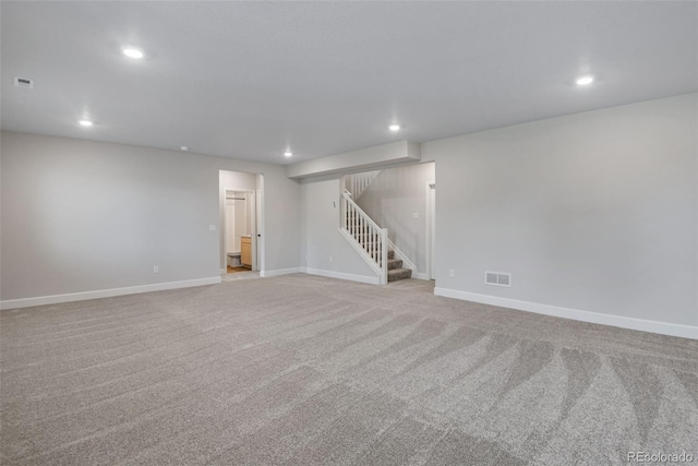 13351 E 100th Pl, Commerce City, CO 80022 - finished below grade area featuring visible vents, stairway, baseboards, carpet flooring, and recessed lighting