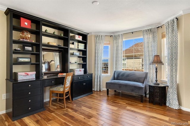 office featuring hardwood / wood-style flooring, a textured ceiling, and crown molding