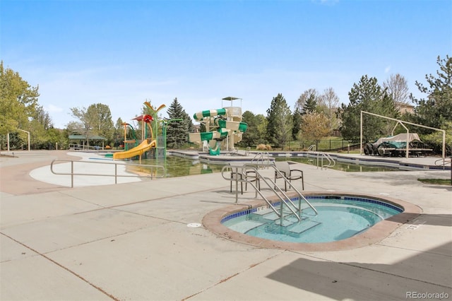 view of pool with a playground