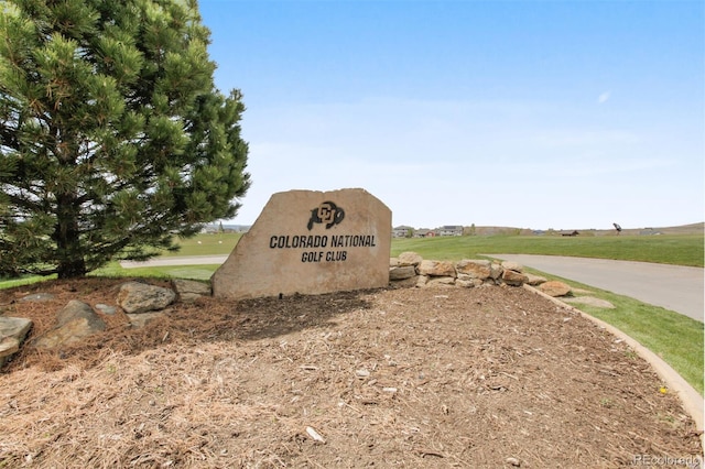 community sign featuring a rural view