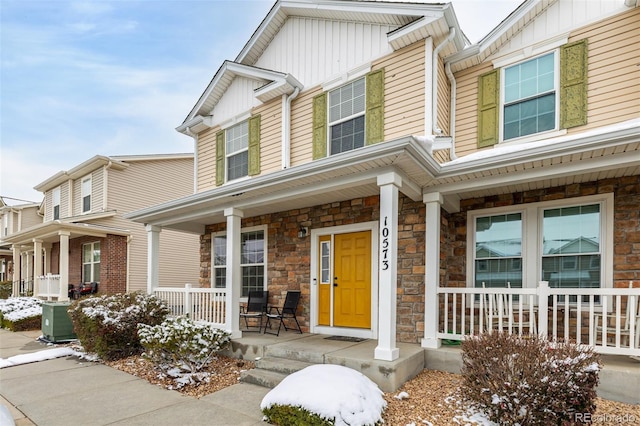 view of front of property featuring central AC unit and covered porch