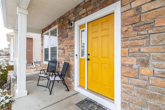 doorway to property with a porch