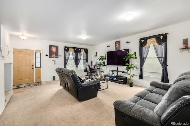 living room featuring plenty of natural light and light carpet