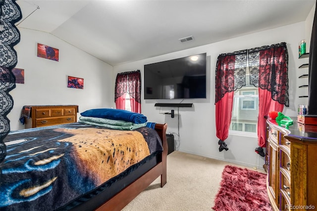 bedroom with carpet and vaulted ceiling