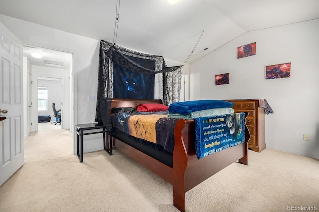 bedroom featuring carpet floors and vaulted ceiling