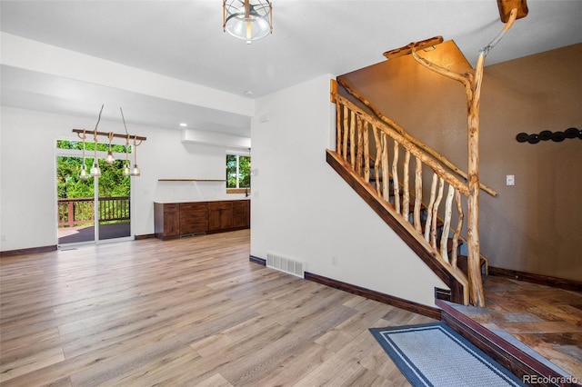 stairs featuring wood-type flooring