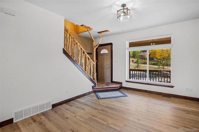 entryway with light hardwood / wood-style flooring