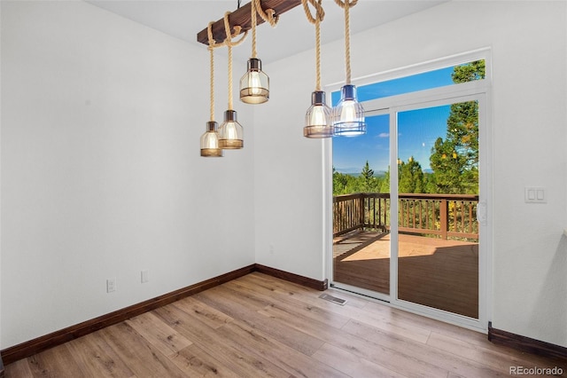 unfurnished dining area with hardwood / wood-style flooring