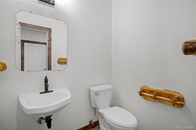 bathroom with sink and toilet