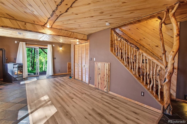 unfurnished living room featuring wood ceiling and hardwood / wood-style flooring