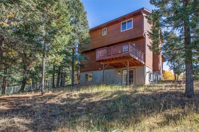 back of house featuring a deck