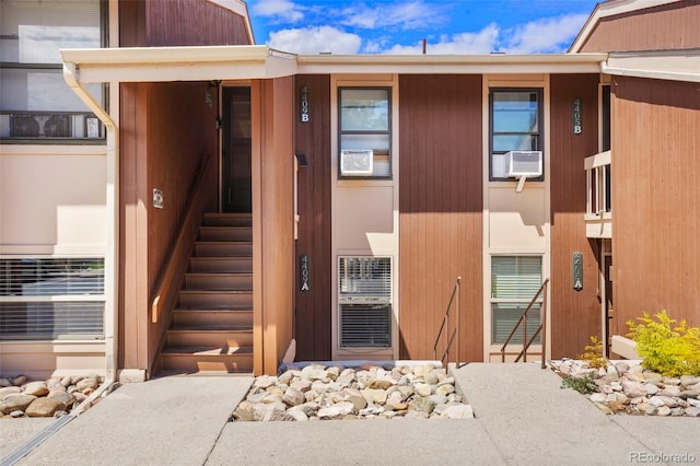 property entrance featuring cooling unit