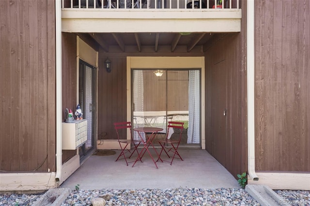 view of exterior entry featuring a patio area