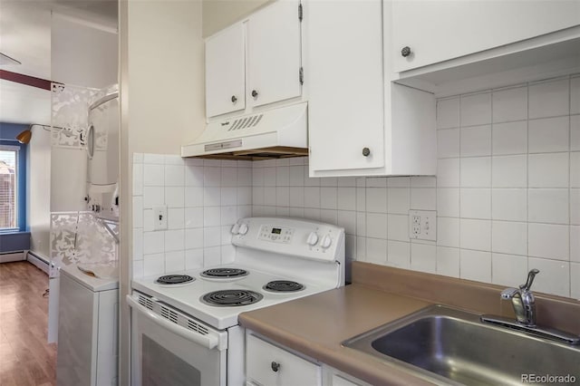 kitchen with white range with electric cooktop, stacked washer and clothes dryer, under cabinet range hood, white cabinetry, and a sink