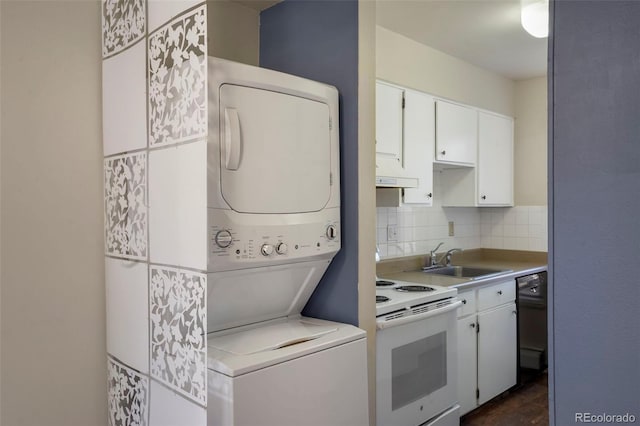 kitchen with white electric range, stacked washer / dryer, a sink, and light countertops