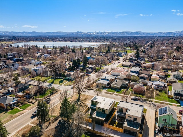 drone / aerial view with a water and mountain view