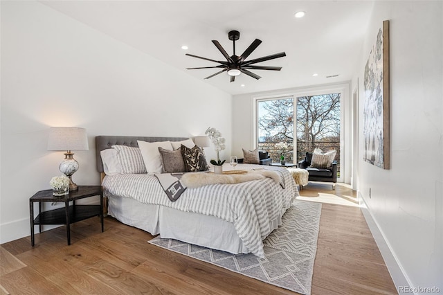 bedroom featuring hardwood / wood-style flooring and ceiling fan