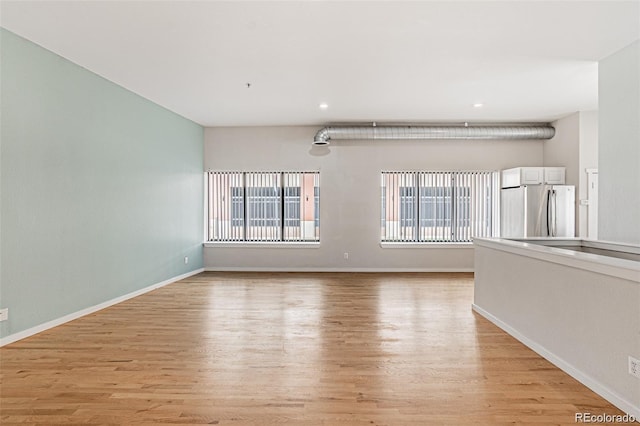 unfurnished room featuring light wood-type flooring