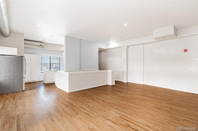 unfurnished living room with light hardwood / wood-style floors