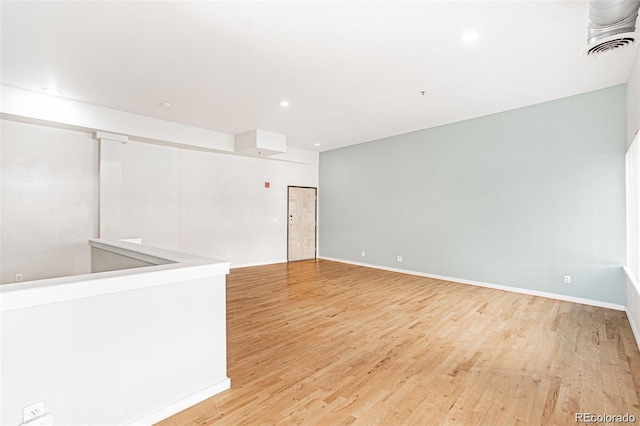 unfurnished room with light wood-type flooring