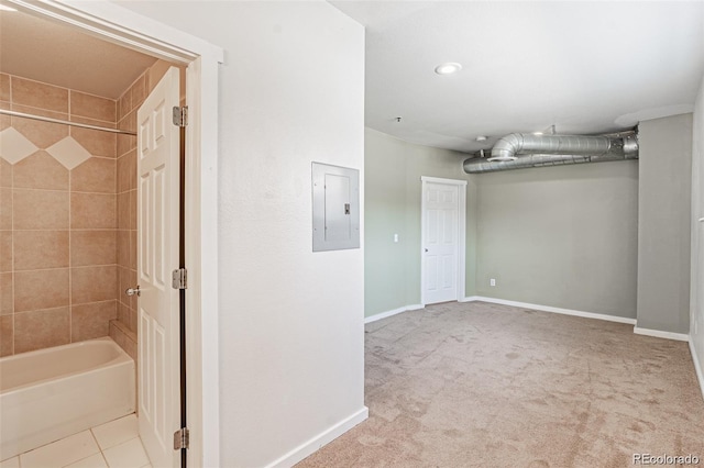 interior space featuring light colored carpet and electric panel