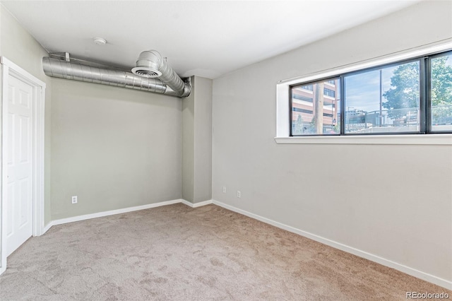 empty room featuring light carpet