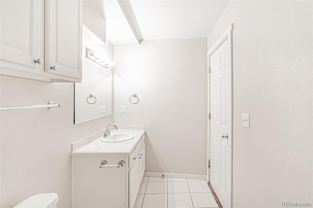 bathroom featuring tile patterned floors, toilet, and vanity