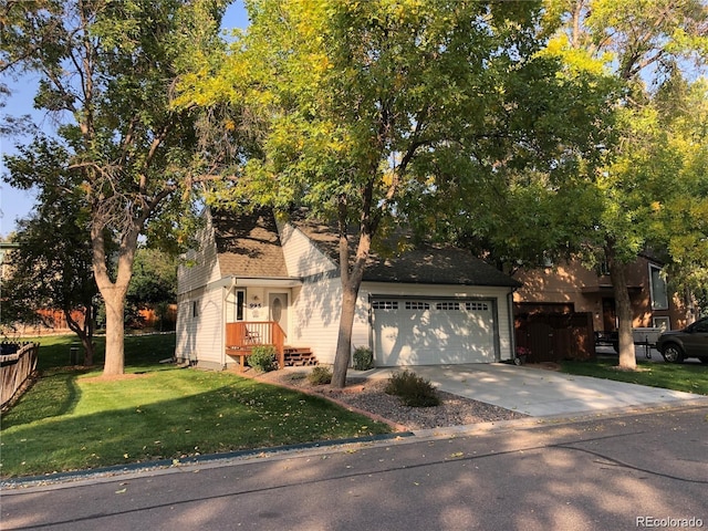 995 W Peakview Cir, Littleton, CO 80120 - view of property hidden behind natural elements with an attached garage and concrete driveway