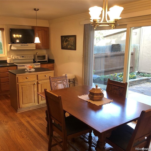 995 W Peakview Cir, Littleton, CO 80120 - dining area with wood finished floors, a chandelier, and ornamental molding