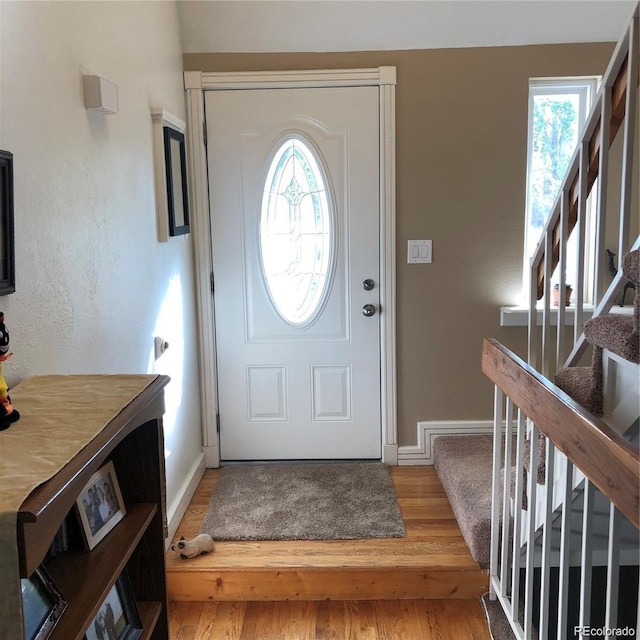 995 W Peakview Cir, Littleton, CO 80120 - foyer featuring stairs and wood finished floors