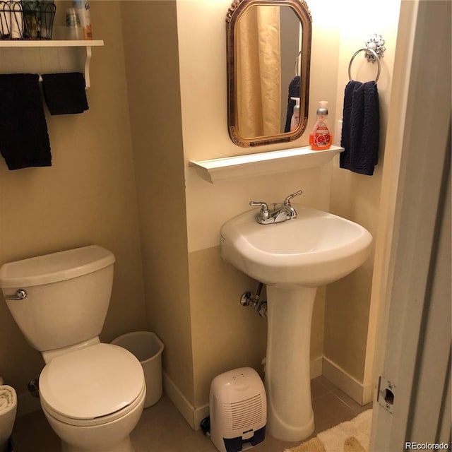 995 W Peakview Cir, Littleton, CO 80120 - half bath featuring toilet and tile patterned floors