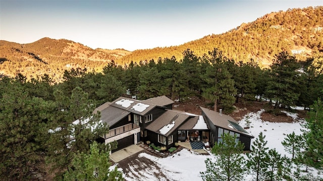 birds eye view of property with a mountain view