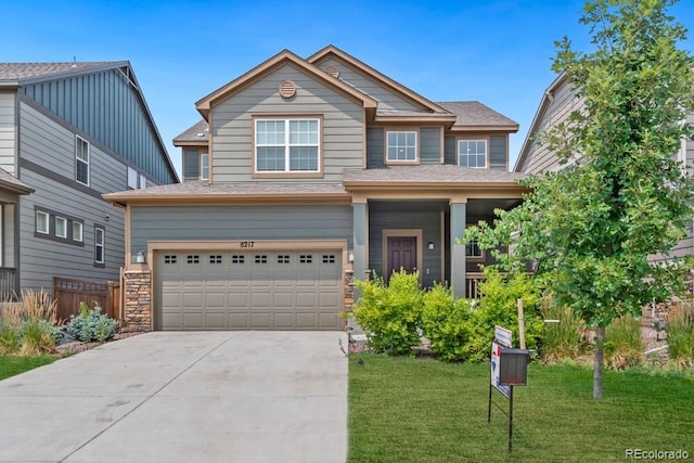 craftsman-style house with a garage and a front yard