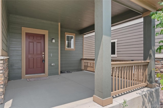 doorway to property featuring a porch