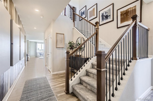 1320 Loraine Cir N, Lafayette, CO 80026 - staircase featuring wood finished floors, baseboards, and recessed lighting