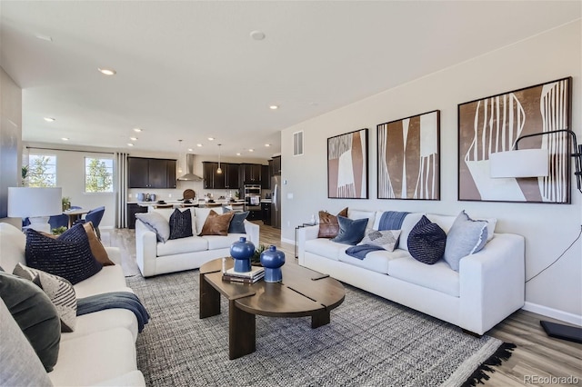 1320 Loraine Cir N, Lafayette, CO 80026 - living room featuring light wood-type flooring, recessed lighting, and baseboards