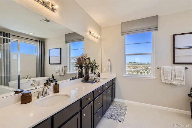 1320 Loraine Cir N, Lafayette, CO 80026 - bathroom featuring baseboards, double vanity, and tile patterned flooring