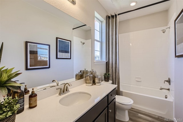 1320 Loraine Cir N, Lafayette, CO 80026 - full bathroom featuring shower / bath combo with shower curtain, vanity, wood finished floors, and toilet