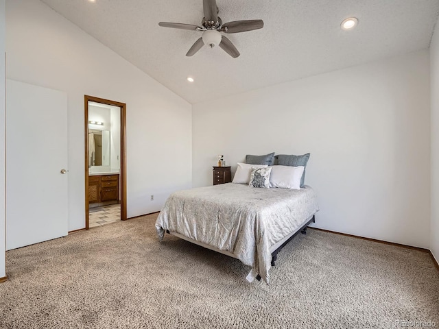 bedroom with lofted ceiling, light carpet, ensuite bathroom, and recessed lighting