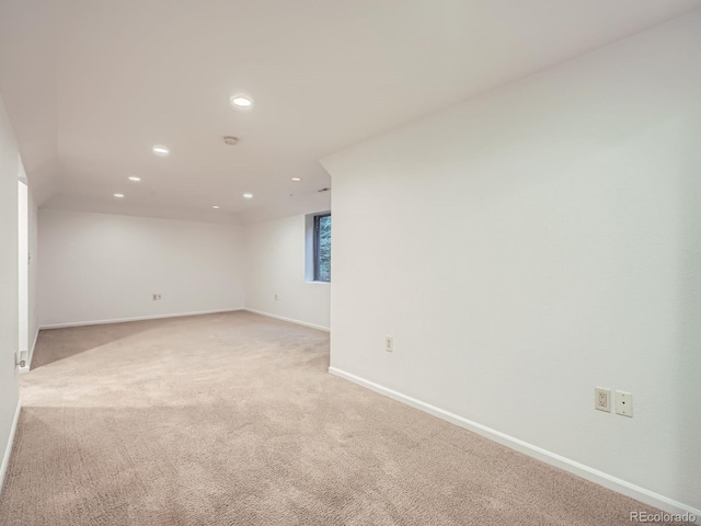 unfurnished room featuring light carpet, baseboards, and recessed lighting