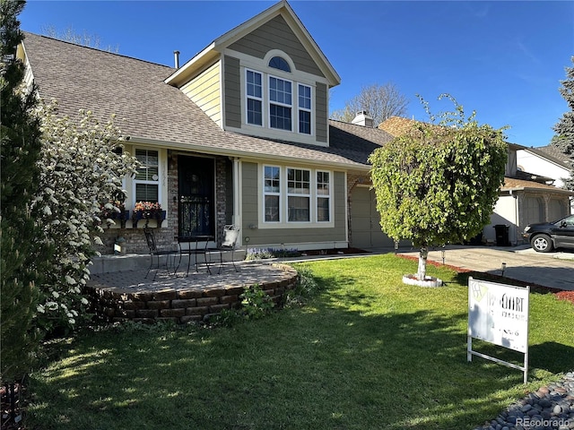 13474 W 65th Dr, Arvada, CO 80004 - view of front of property with a shingled roof, an attached garage, a front yard, and driveway