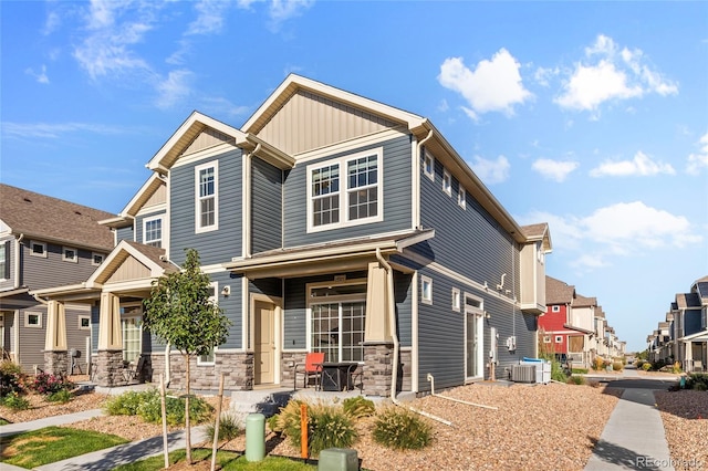 craftsman-style house with central AC unit