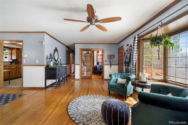 living room with french doors, ceiling fan, crown molding, and hardwood / wood-style floors