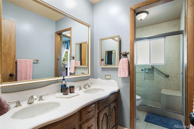 bathroom with vanity, a healthy amount of sunlight, toilet, and walk in shower