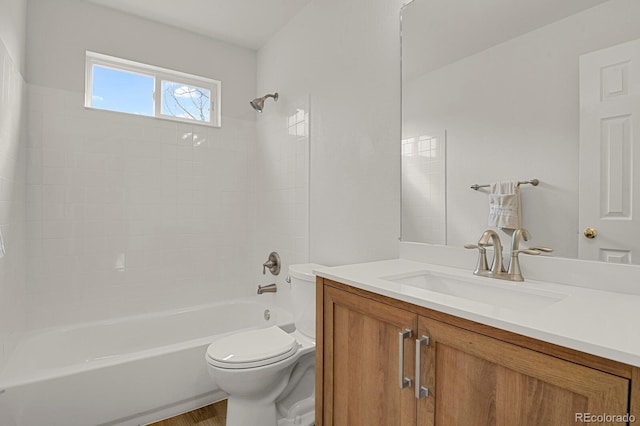 full bathroom with tub / shower combination, vanity, and toilet