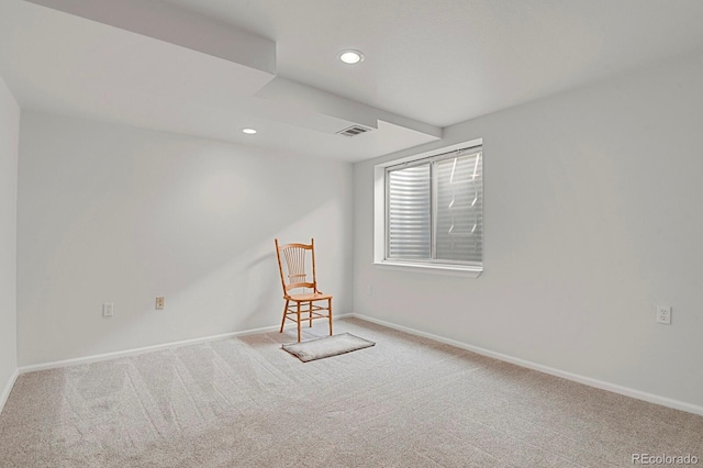 empty room with carpet, visible vents, baseboards, and recessed lighting