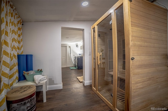 corridor featuring dark hardwood / wood-style floors