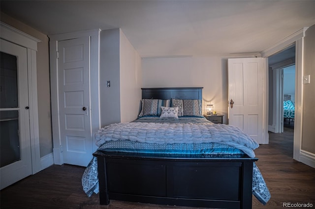 bedroom featuring dark hardwood / wood-style flooring